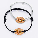 Pair of personalised bracelets with engraved oval wooden medallions 25x17mm imprints