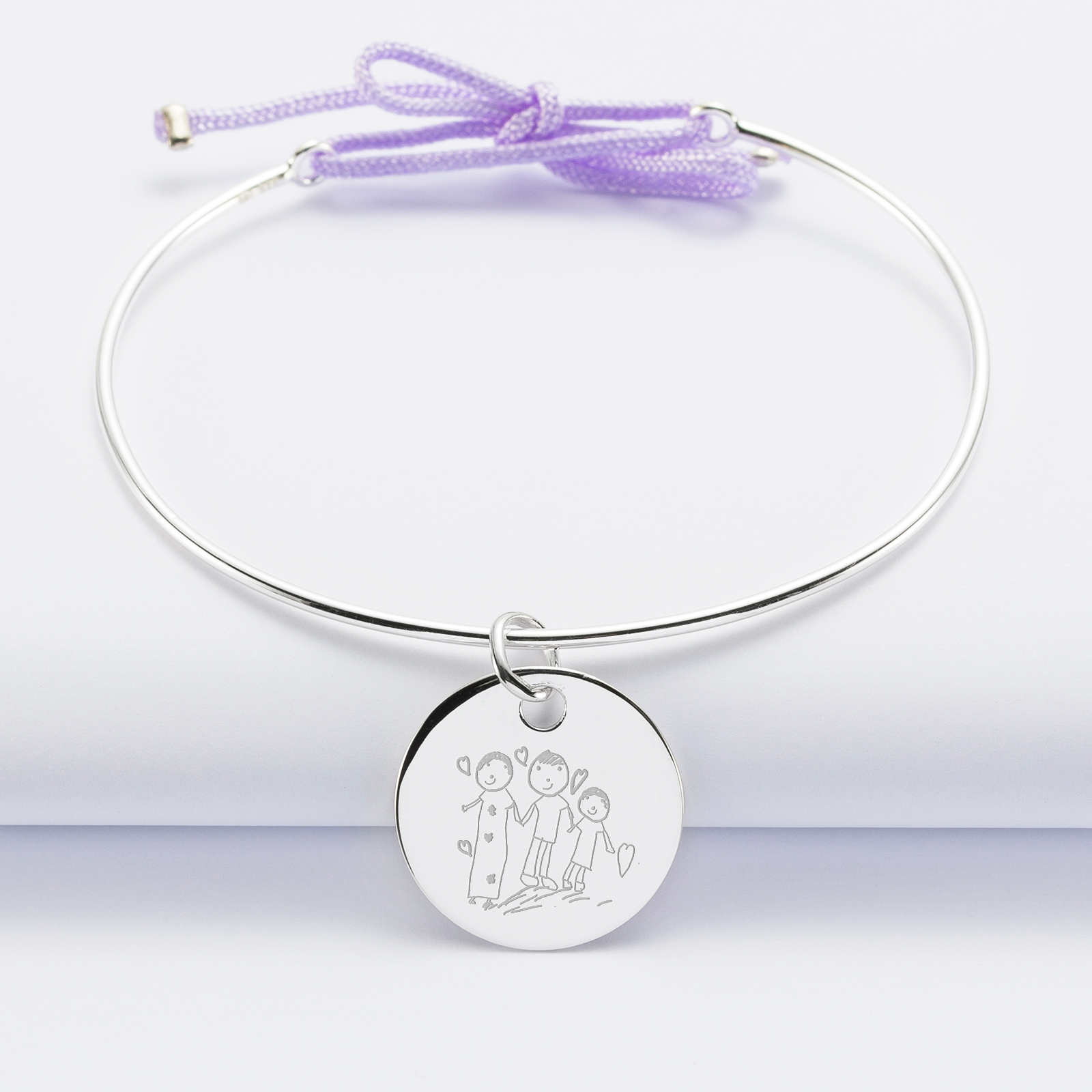 Personalised silver and cord bangle bracelet and 19 mm engraved medallion - sketch