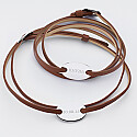 Pair of personalised leather bracelets with engraved 2-hole oval silver medallions 25x16mm - dates