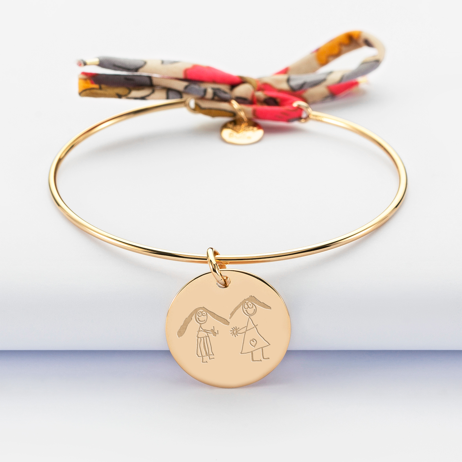 Personalised gold plate bangle with Liberty cord and 19 mm engraved medallion - sketch