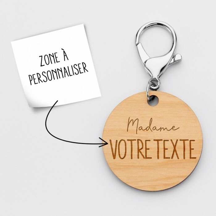 Personalised engraved wooden "Ms." round medallion keyring 50mm explanation