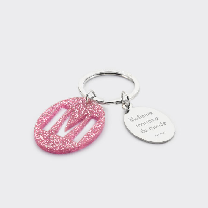 Porte-clés personnalisé médaille gravée ovale acier et breloque initiale acrylique pailleté rose texte + picto