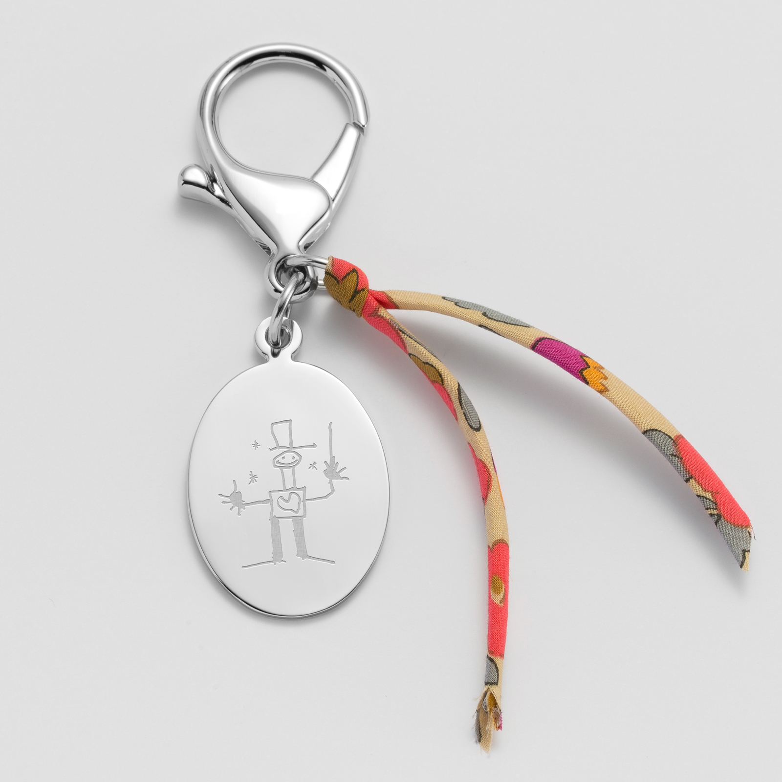 Bijou de sac personnalisé médaille gravée acier ovale 28x20 et noeud Liberty - dessin