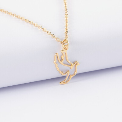 Pendentif enfant colombe plaqué or 18 mm