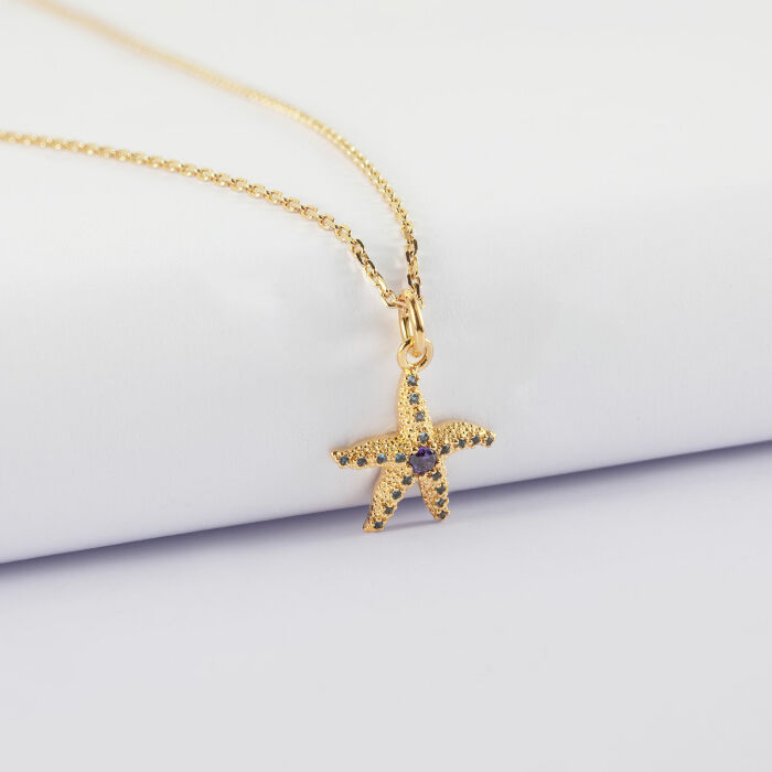 Pendentif étoile de mer scintillante zircons bleus plaqué or 15 mm - devant