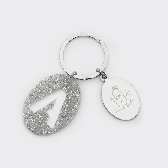Porte-clés personnalisé médaille gravée ovale acier et breloque initiale acrylique pailleté argenté dessin