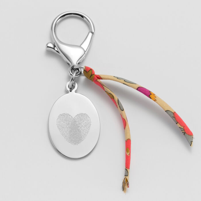 Bijou de sac personnalisé médaille gravée acier ovale 28x20 et noeud Liberty - empreinte digital