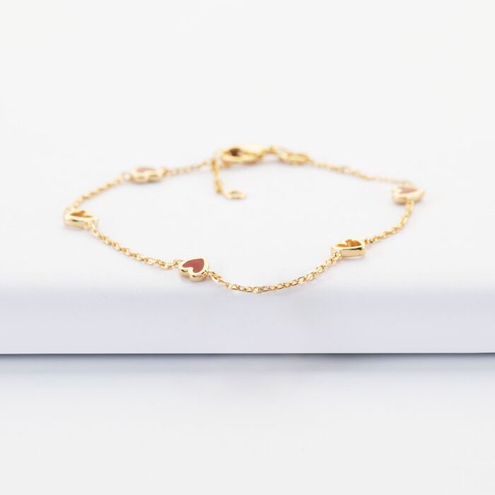 Bracelet chaîne cœurs ajourés et email plaqué or - plat