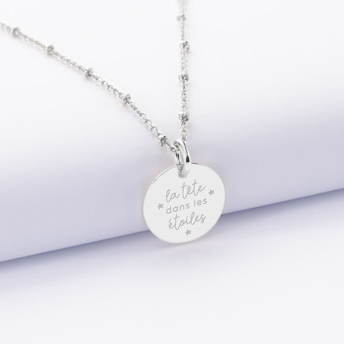 Pendentif personnalisé médaille gravée argent 15 mm - illu la tete dans les étoiles